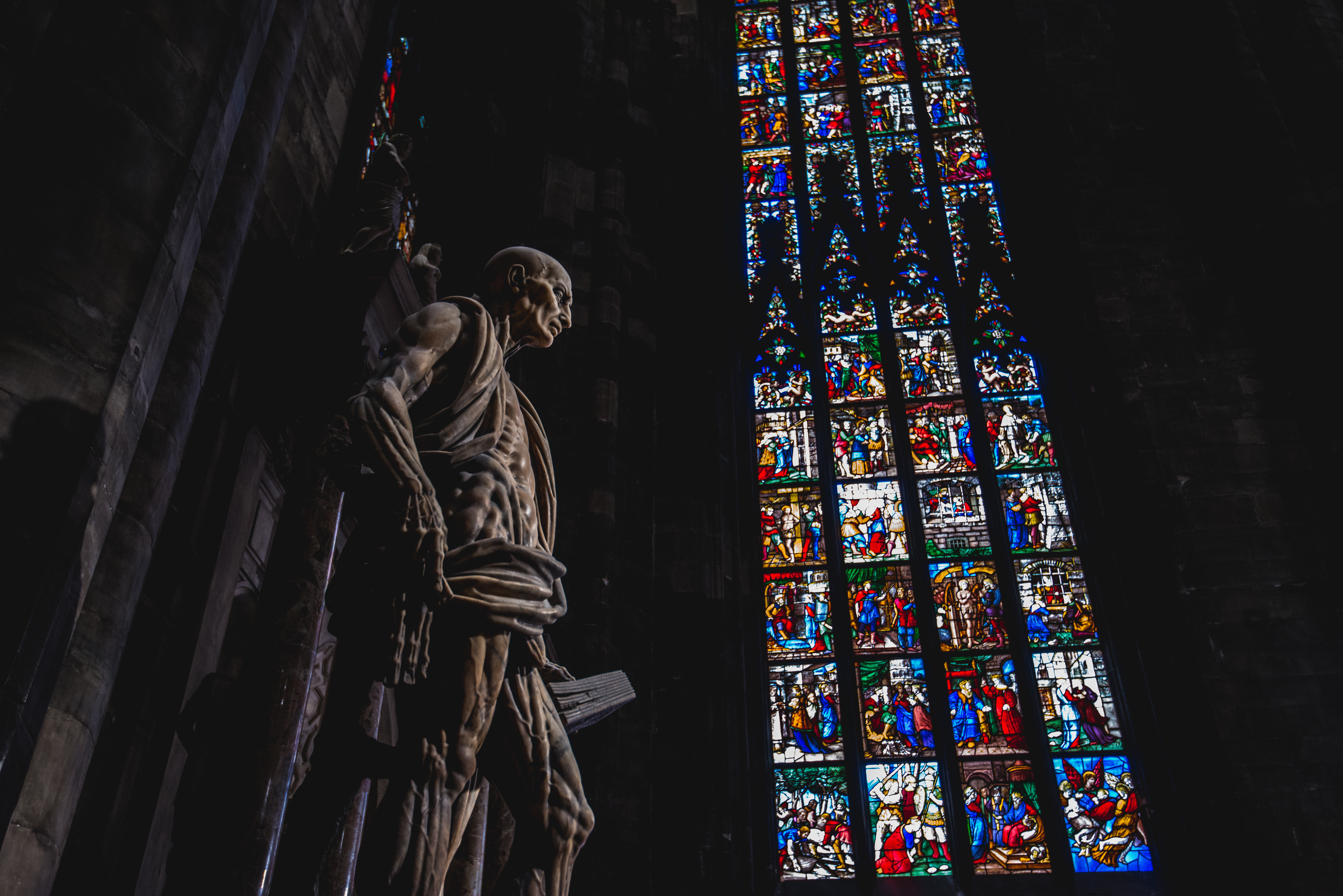 An image showing the statue of St Bartholomew in the Milan Duomo.